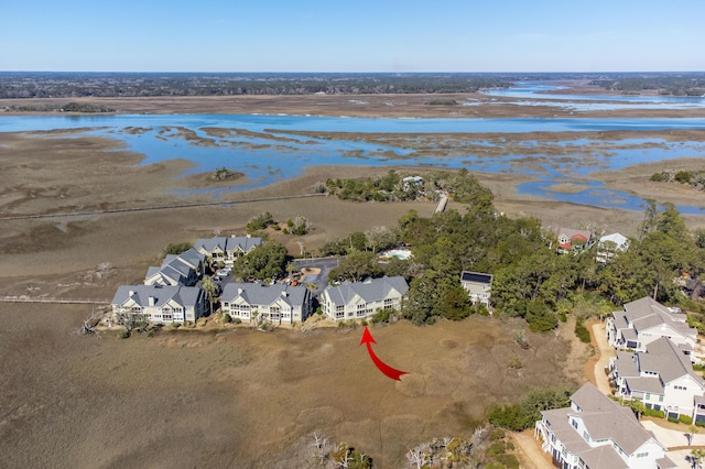 drone / aerial view featuring a water view and a residential view