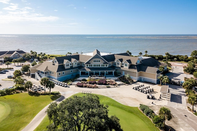 bird's eye view with view of golf course and a water view