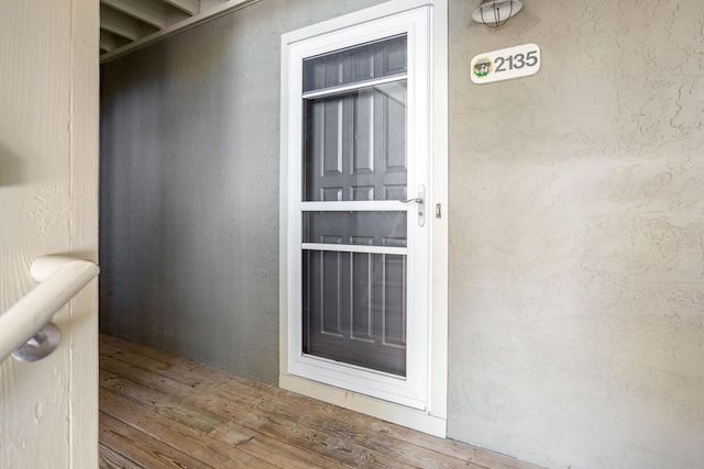 property entrance featuring stucco siding