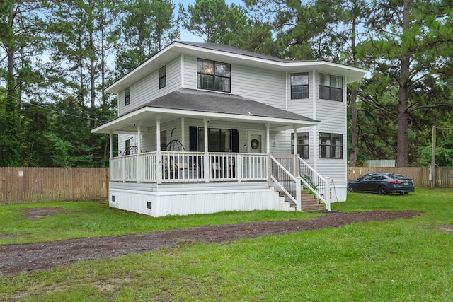 view of front of property with a porch and a front lawn