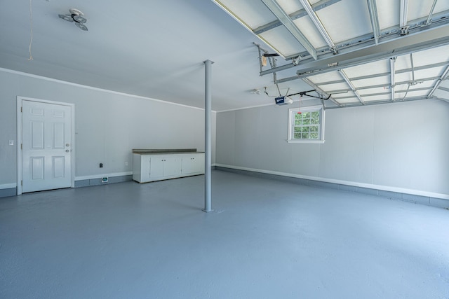garage with baseboards and a garage door opener