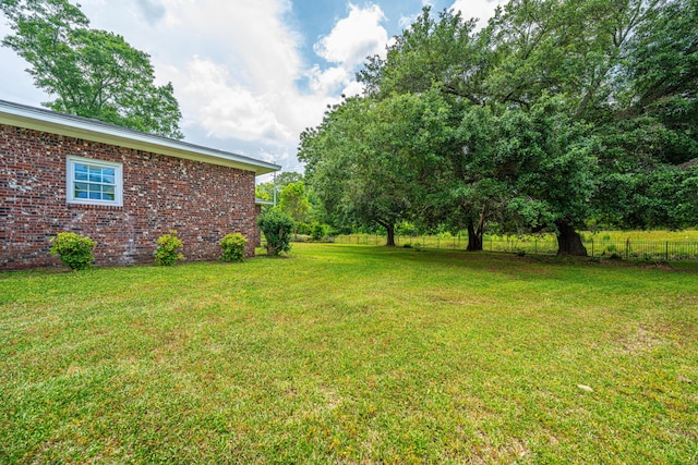 view of yard with fence