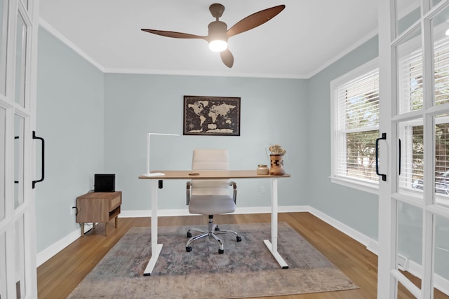 office space with ornamental molding, wood-type flooring, and ceiling fan