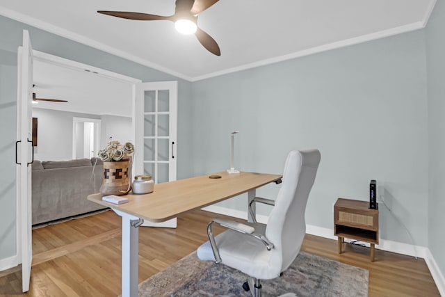 home office featuring crown molding, ceiling fan, and wood-type flooring