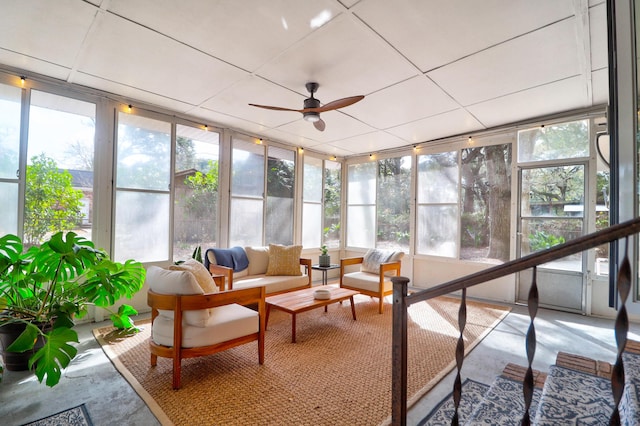 sunroom featuring a healthy amount of sunlight and ceiling fan