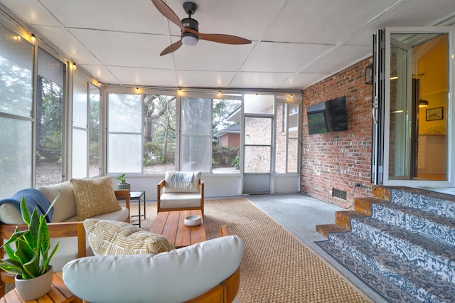 sunroom / solarium with ceiling fan