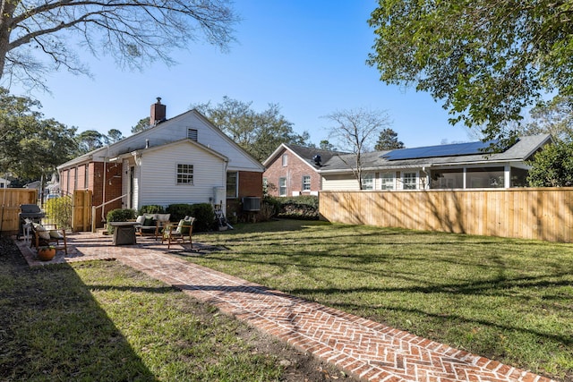 view of yard featuring cooling unit and fence