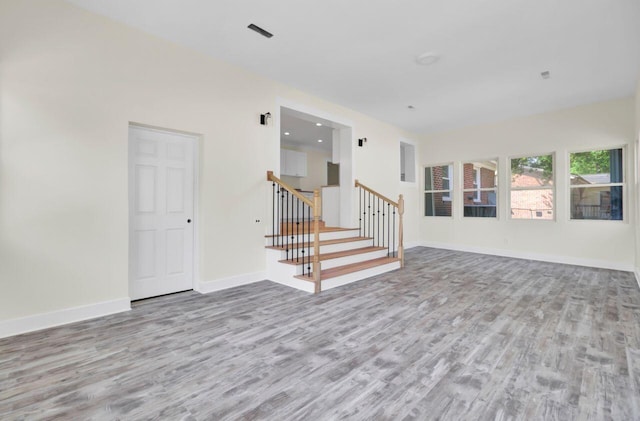 8612 Delhi Rd, North Charleston, SC 29406 - empty room featuring wood finished floors, stairway, and baseboards