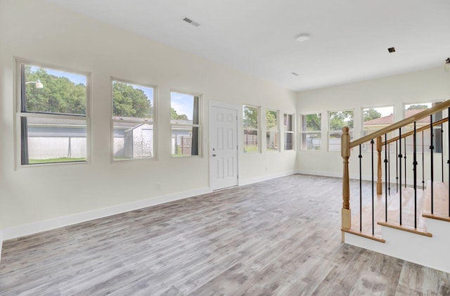 8612 Delhi Rd, North Charleston, SC 29406 - spare room with wood finished floors, baseboards, and stairway