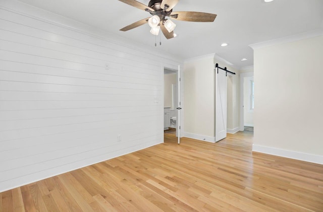 8612 Delhi Rd, North Charleston, SC 29406 - spare room featuring crown molding, a ceiling fan, a barn door, baseboards, and recessed lighting