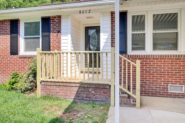 8612 Delhi Rd, North Charleston, SC 29406 - entrance to property featuring brick siding and covered porch