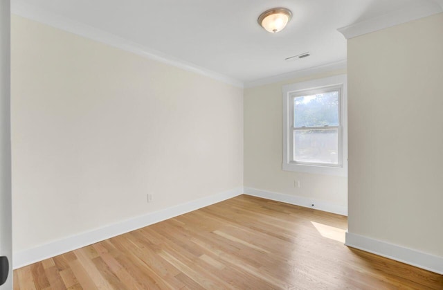 8612 Delhi Rd, North Charleston, SC 29406 - spare room featuring baseboards, light wood-type flooring, and crown molding