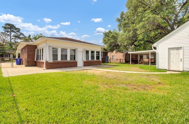 8612 Delhi Rd, North Charleston, SC 29406 - back of property featuring brick siding and a patio