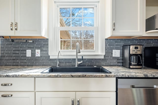 115 Clubhouse Rd, Summerville, SC 29483 - kitchen with a sink, white cabinets, stainless steel dishwasher, and decorative backsplash