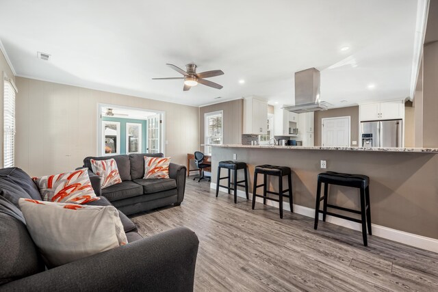 115 Clubhouse Rd, Summerville, SC 29483 - living area with crown molding, light wood finished floors, a ceiling fan, and visible vents