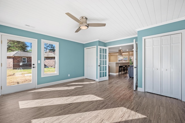 115 Clubhouse Rd, Summerville, SC 29483 - unfurnished bedroom featuring ornamental molding, access to exterior, wood finished floors, multiple closets, and french doors