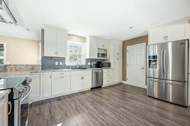 115 Clubhouse Rd, Summerville, SC 29483 - kitchen with light stone countertops, visible vents, appliances with stainless steel finishes, a sink, and wood finished floors