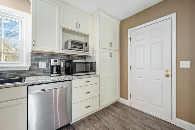 115 Clubhouse Rd, Summerville, SC 29483 - kitchen featuring tasteful backsplash, white cabinets, baseboards, appliances with stainless steel finishes, and dark wood finished floors