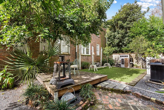 view of yard featuring a wooden deck