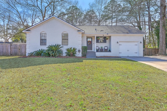 ranch-style house featuring fence, driveway, a front lawn, a garage, and brick siding