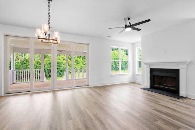 1076 Williams Rd, Charleston, SC 29412 - unfurnished living room featuring a chandelier, baseboards, ceiling fan, and wood finished floors