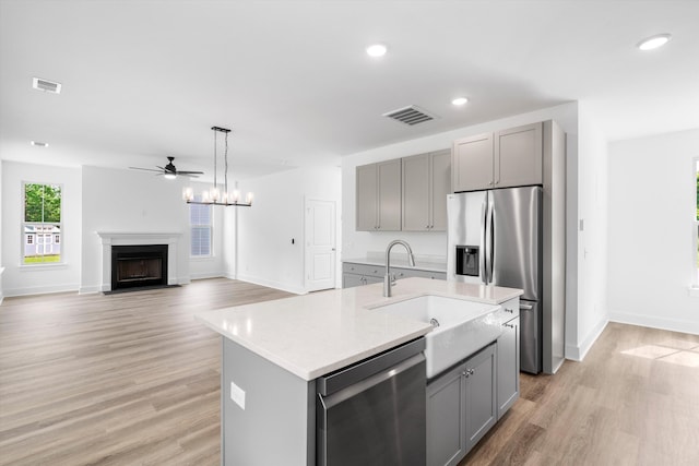 1076 Williams Rd, Charleston, SC 29412 - kitchen featuring gray cabinetry, stainless steel appliances, a sink, light countertops, and recessed lighting