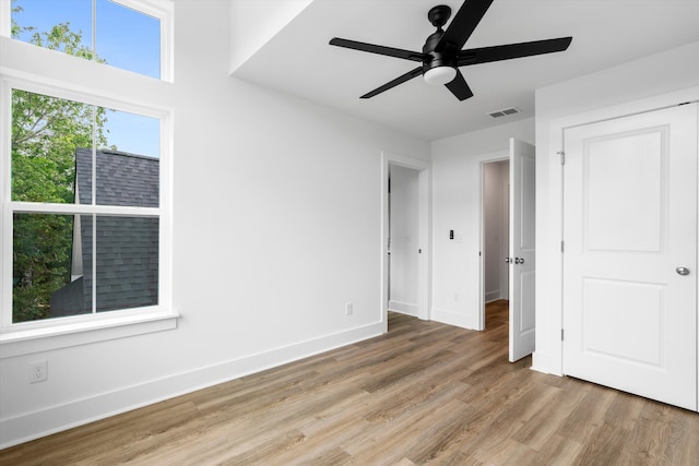1076 Williams Rd, Charleston, SC 29412 - unfurnished bedroom with light wood-style floors, baseboards, and a ceiling fan