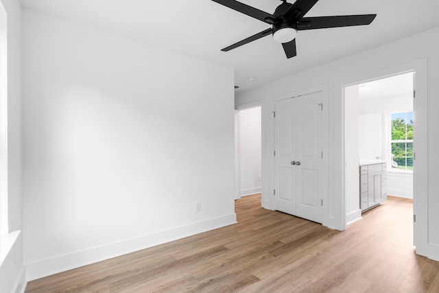 1076 Williams Rd, Charleston, SC 29412 - unfurnished bedroom featuring light wood finished floors, baseboards, a closet, and a ceiling fan
