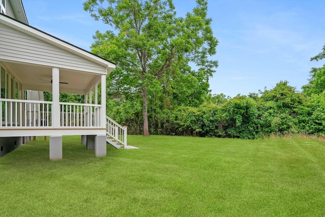 1076 Williams Rd, Charleston, SC 29412 - view of grassy yard featuring a ceiling fan and stairs