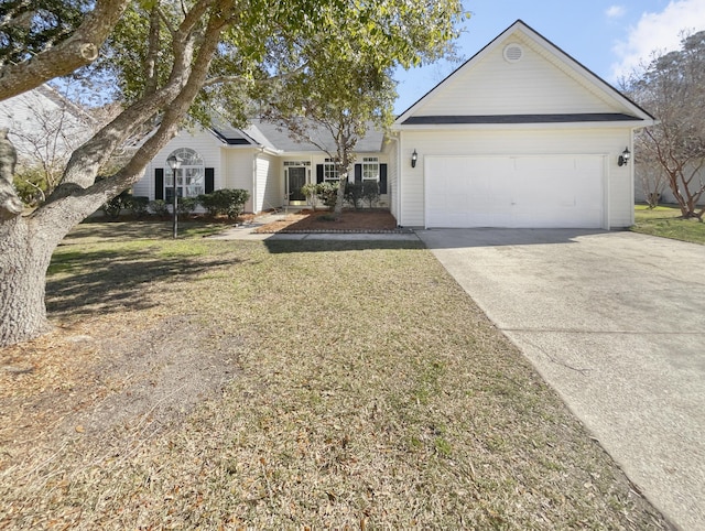 ranch-style home featuring a garage, driveway, and a front lawn