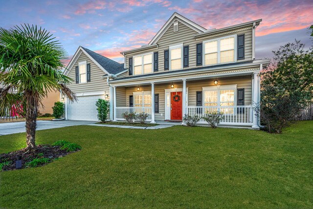 view of front of house featuring a front yard, a garage, cooling unit, and covered porch