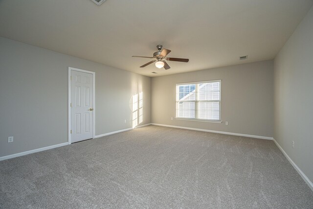 exercise room with carpet floors and ceiling fan