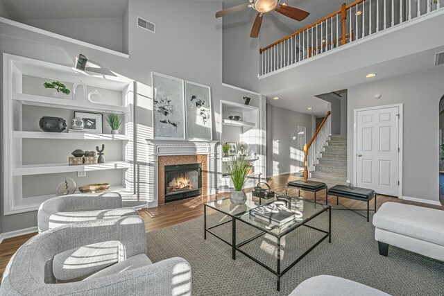 living room featuring ceiling fan and light wood-type flooring