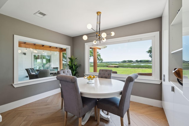 dining space featuring healthy amount of natural light and baseboards