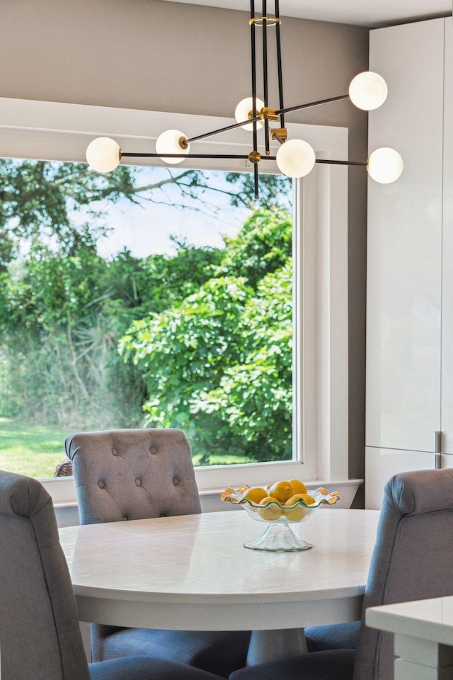 dining area featuring a chandelier