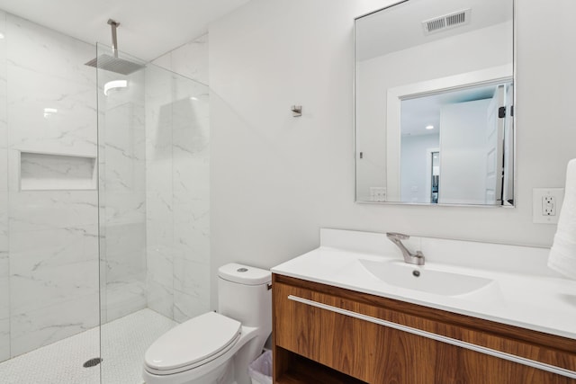 full bathroom with vanity, toilet, and a marble finish shower