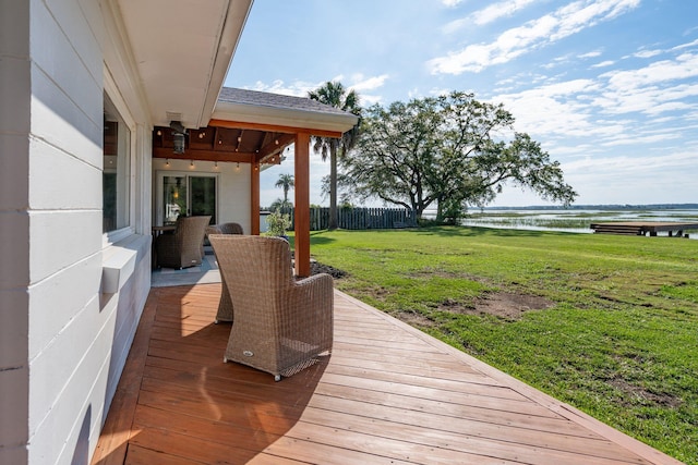 wooden deck with a water view