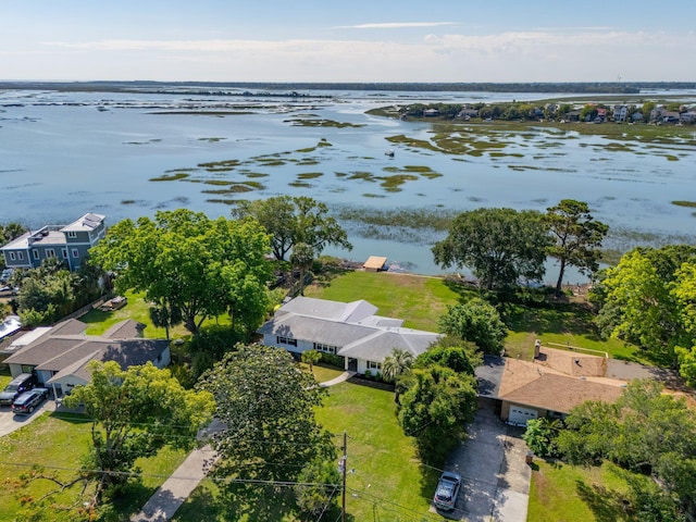 aerial perspective of suburban area with a large body of water