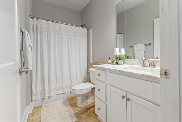 bathroom featuring toilet, vanity, and shower / tub combo with curtain