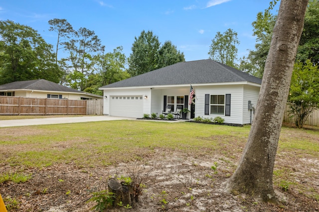 view of front of house featuring driveway, a garage, and roof with shingles