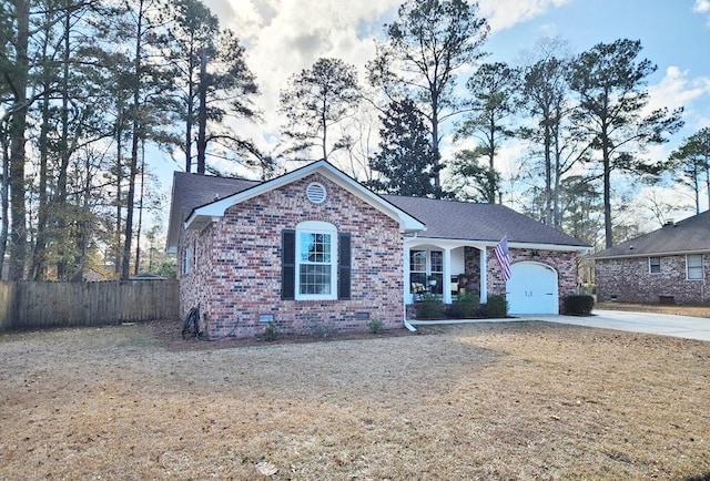 single story home featuring a garage and a front lawn