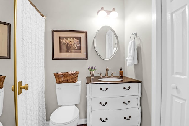 bathroom with vanity and toilet