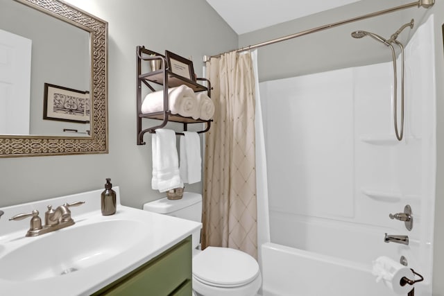 full bathroom with shower / tub combo with curtain, vanity, and toilet