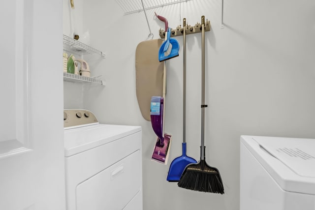 clothes washing area with independent washer and dryer