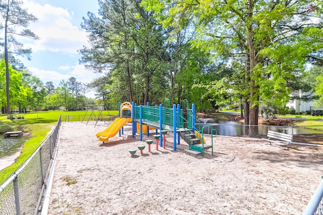 view of jungle gym featuring a water view