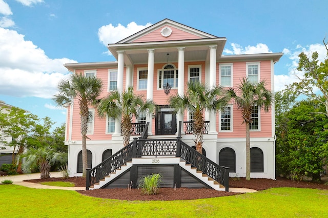 2128 Breezy Point Dr, Mount Pleasant, SC 29466 - view of front of property featuring stairs, a front yard, covered porch, and stucco siding