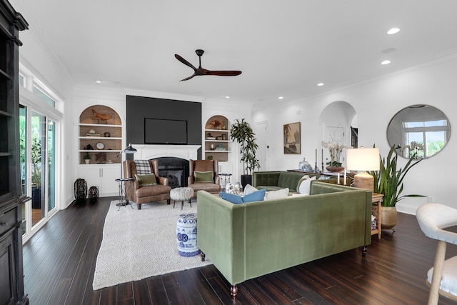 2128 Breezy Point Dr, Mount Pleasant, SC 29466 - living room featuring ceiling fan, built in shelves, recessed lighting, a glass covered fireplace, and ornamental molding