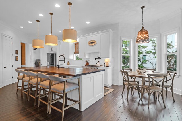 2128 Breezy Point Dr, Mount Pleasant, SC 29466 - kitchen featuring a sink, recessed lighting, dark wood-style floors, an island with sink, and white cabinets