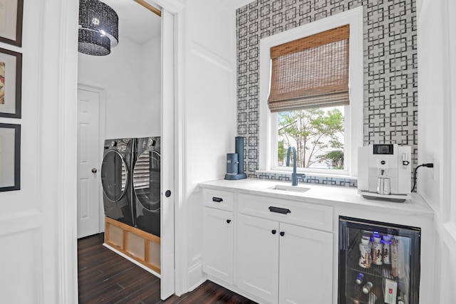 2128 Breezy Point Dr, Mount Pleasant, SC 29466 - bar featuring beverage cooler, separate washer and dryer, a sink, and dark wood-style floors