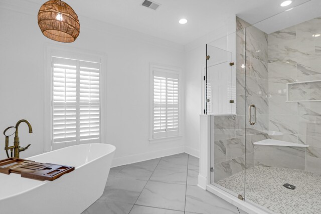 2128 Breezy Point Dr, Mount Pleasant, SC 29466 - full bath featuring marble finish floors, a marble finish shower, a freestanding bath, recessed lighting, and baseboards